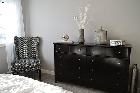 black wooden lowboy dresser with all drawers closed thumbnail