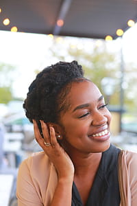 Woman Resting Hand on Ear thumbnail