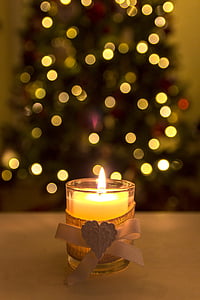 lighted votive candle with bokeh lights thumbnail
