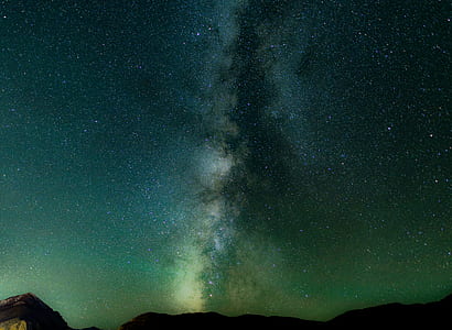 Milkyway galaxy above mountains during nighttime thumbnail