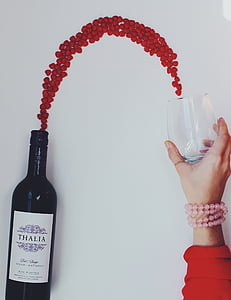 Thalia wine bottle beside clear beverage glass thumbnail