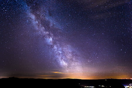 silhouette of terrain under starry sky thumbnail