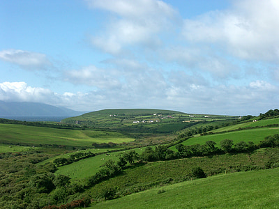 landscape photography of green hills during daytime thumbnail