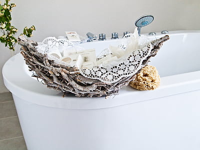 white steel bathtub beside gray stump and brown sponge thumbnail