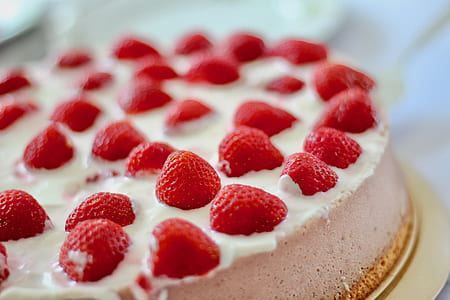 white icing-covered cake with strawberries thumbnail