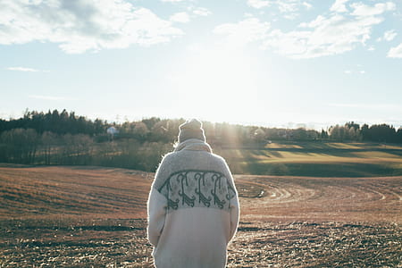 woman walking on brown soil thumbnail