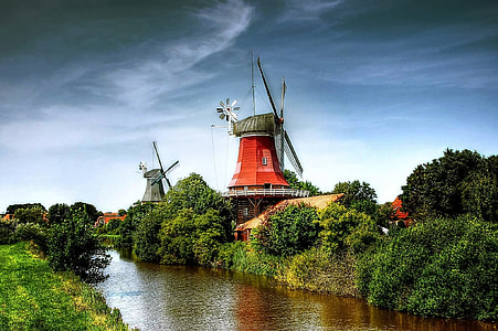 orange windmill near creek thumbnail