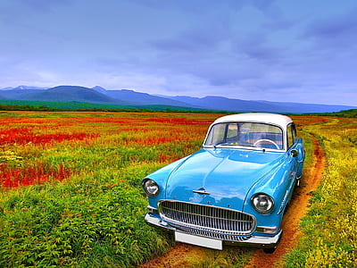 blue and white car parked on dirt road thumbnail