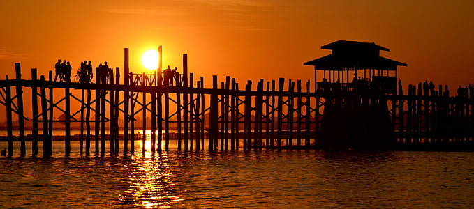 silhouette of beach dock during sunset thumbnail