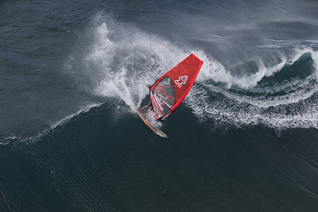 Person in Surfboard in the Wave during Daytime thumbnail