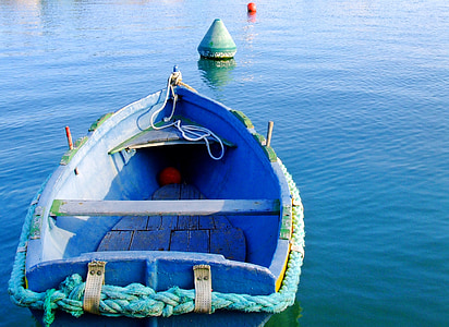brown jon boat on body of water near to floater thumbnail