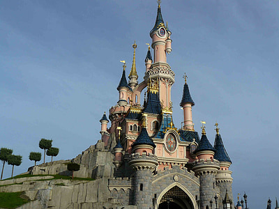 pink and gray castle on rock formation thumbnail