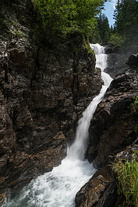waterfalls near green trees thumbnail