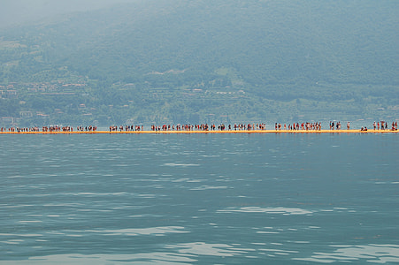 group of people near body of water thumbnail