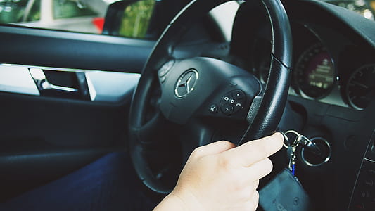 person driving Mercedes-Benz vehicle at daytime thumbnail