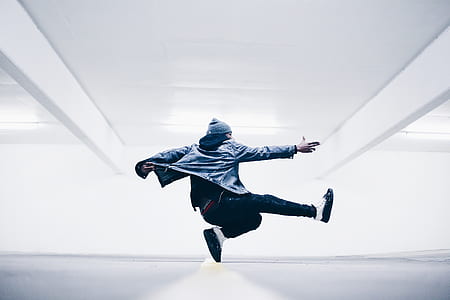 man jumping while pointing forward thumbnail