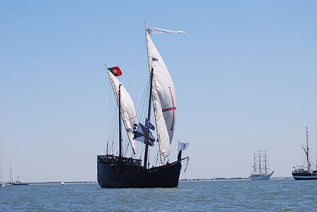 black and white boat on calm water at daytime thumbnail