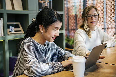 woman wearing gray striped top using laptop thumbnail