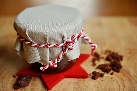 gray cover with red and white rope tied on jar thumbnail