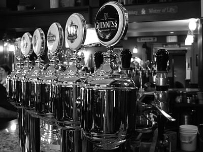 beverage dispenser on grayscale photography thumbnail