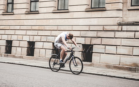 Man Riding Black Mountain Bike on Pathway during Daytime thumbnail