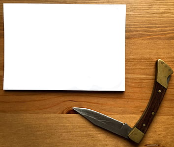 White Printer Paper Near Gray Stainless Steel Pocket Knife thumbnail