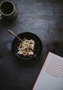round black cooking pot with food near cookbook thumbnail
