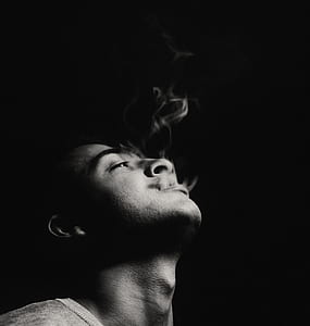 man smoking greyscale photography thumbnail