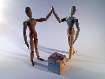 two brown wooden figure thumbnail