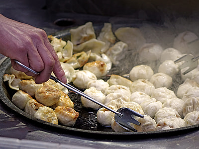 person holding grey steel thong while getting dumplings thumbnail