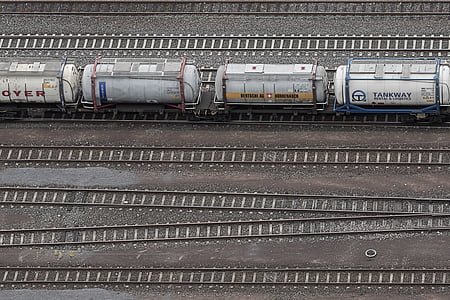 white and gray metal container on railway thumbnail