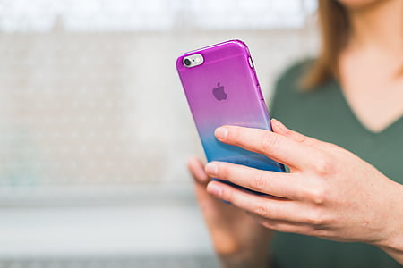 person holding iPhone thumbnail