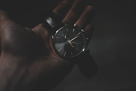 round silver-colored chronograph watch with black leather strap thumbnail