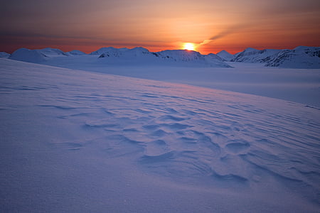 mountain covered with snow at sunset thumbnail