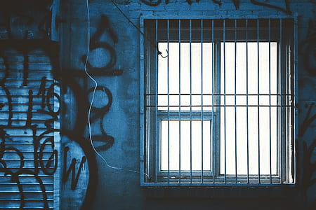 gray metal window frame near gray roll-up door thumbnail