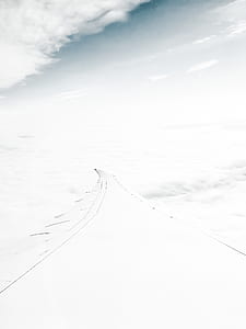 airplane wing under cumulus clouds thumbnail