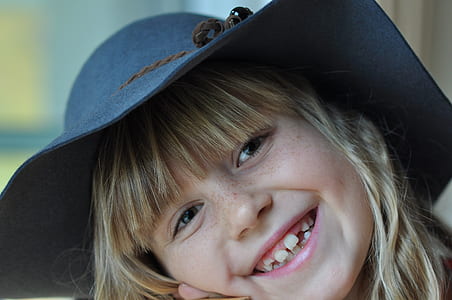 girl wearing black sun hat thumbnail
