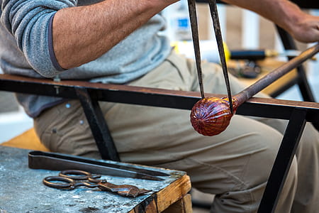 man sitting holding curtain rod thumbnail