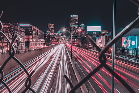 time-lapsed photo of vehicle passing through road during nighttime thumbnail