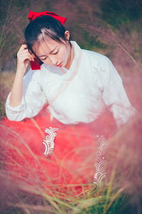 woman sitting on grass thumbnail