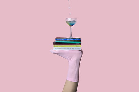wine glass on top of stack books thumbnail