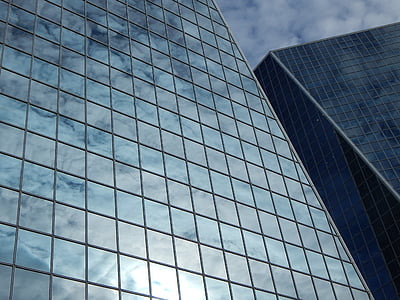 sun and clouds reflection on buildingh thumbnail