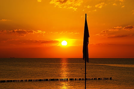 silhouette of flag during golden hour thumbnail