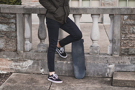 person standing beside concrete balustrade thumbnail