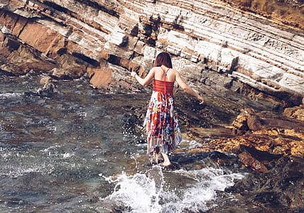 Woman Standing on Rocks thumbnail