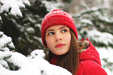 Girl wearing hat in winter snow and ice thumbnail