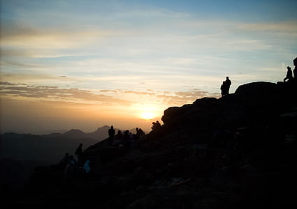 Silhouette of Group of Person Hiking on the Mountain thumbnail