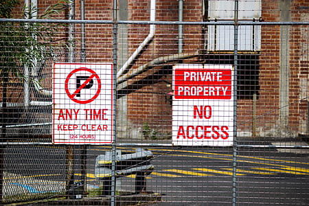 private property no access sign on gray fence thumbnail