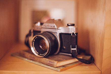 tilt shift photo of gray and black Pentax film camera thumbnail