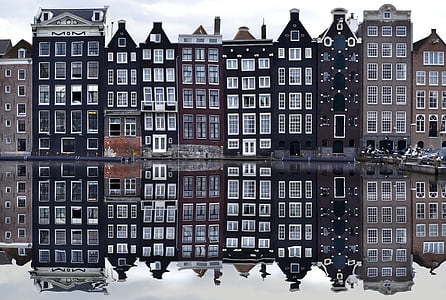 city buildings near body of water during daytime thumbnail